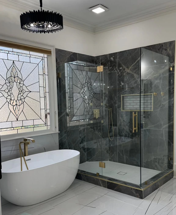 Luxury frameless shower with premium clamp and sleeve over details